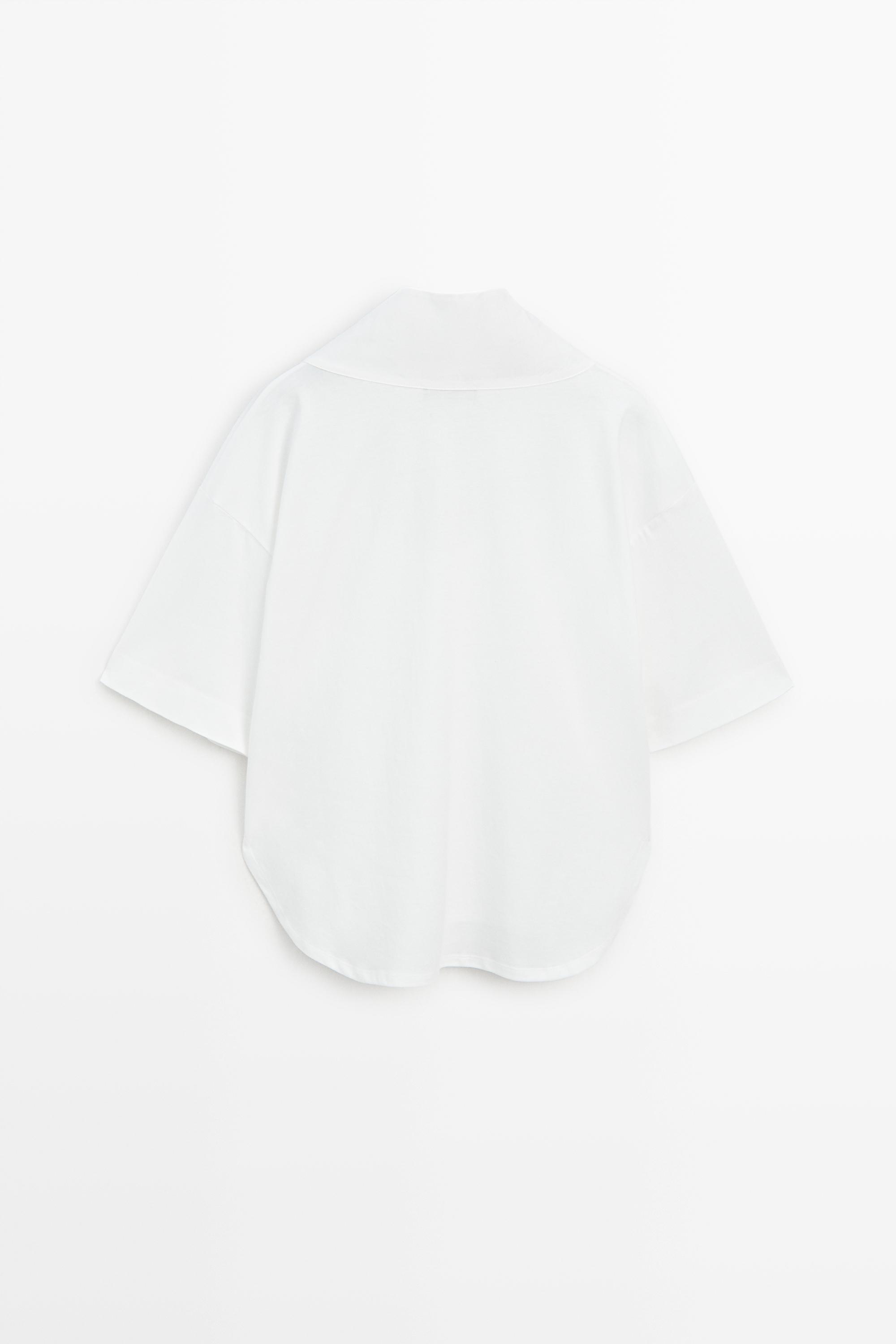 Blouse en coton à col ouvert et manches courtes